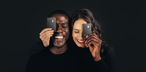 Couple enjoying cashless convenience with contactless credit cards