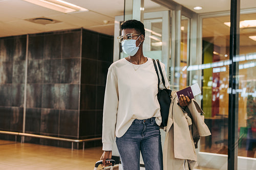 Woman with face mask at airport
