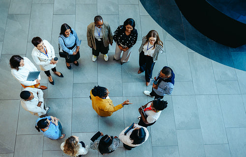 Arial view of new hire orientation in a modern lobby