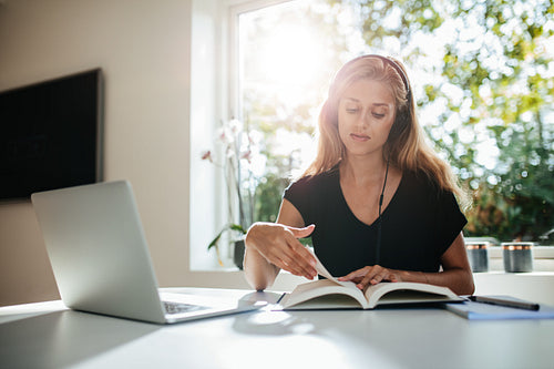 Young woman studying at home