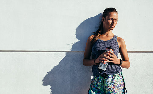 Sportswoman relaxing after exercising