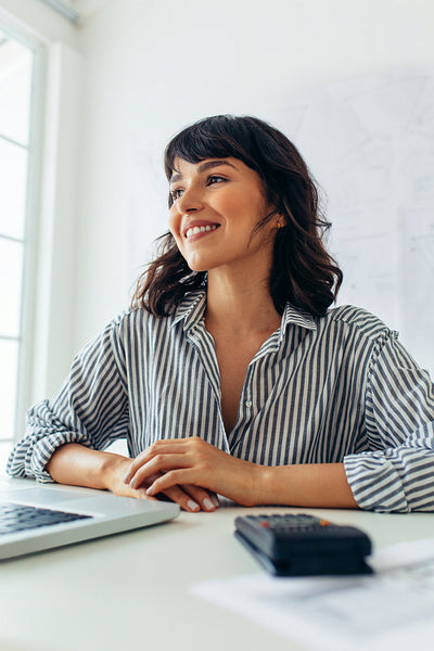 Close up of businesswoman sitting in office