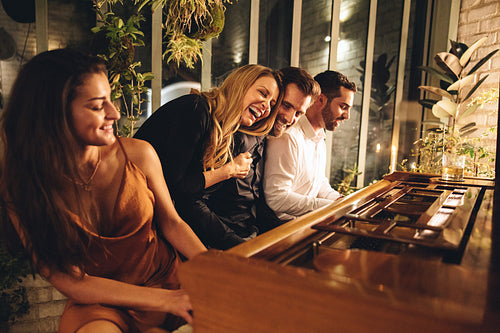 Four friends having fun in a luxury hotel