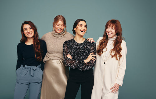 Cheerful group of women smiling in a studio