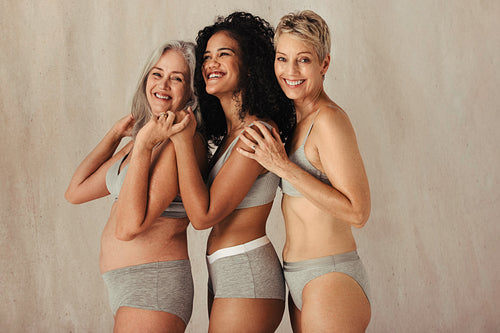 Natural women of different ages posing in a studio
