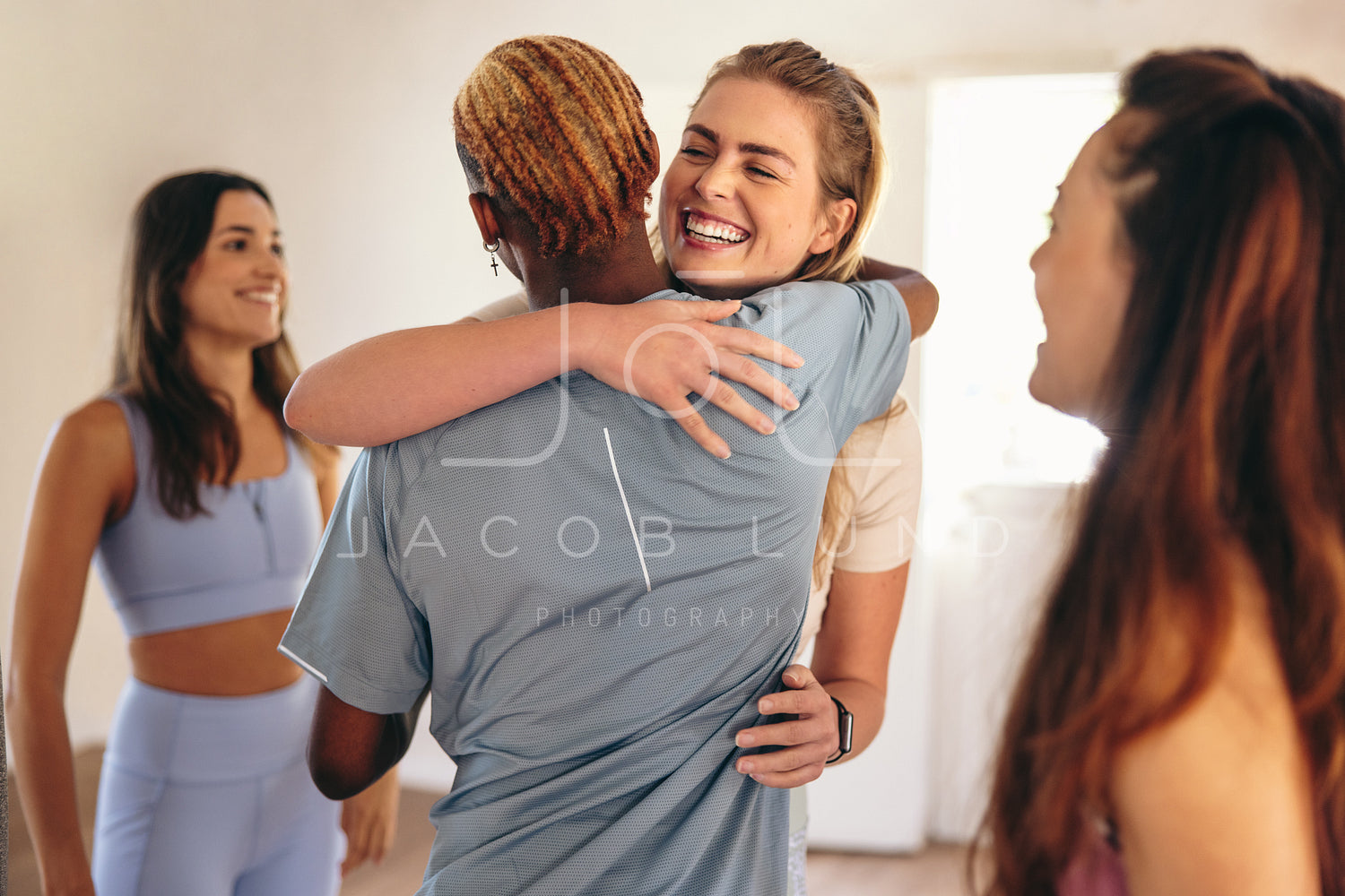 Diverse young girls in sportswear hugging after outdoor yoga class in park  Stock Photo - Alamy