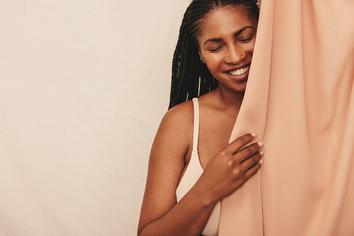 Two young women embracing their natural bodies while wearing brown underwear