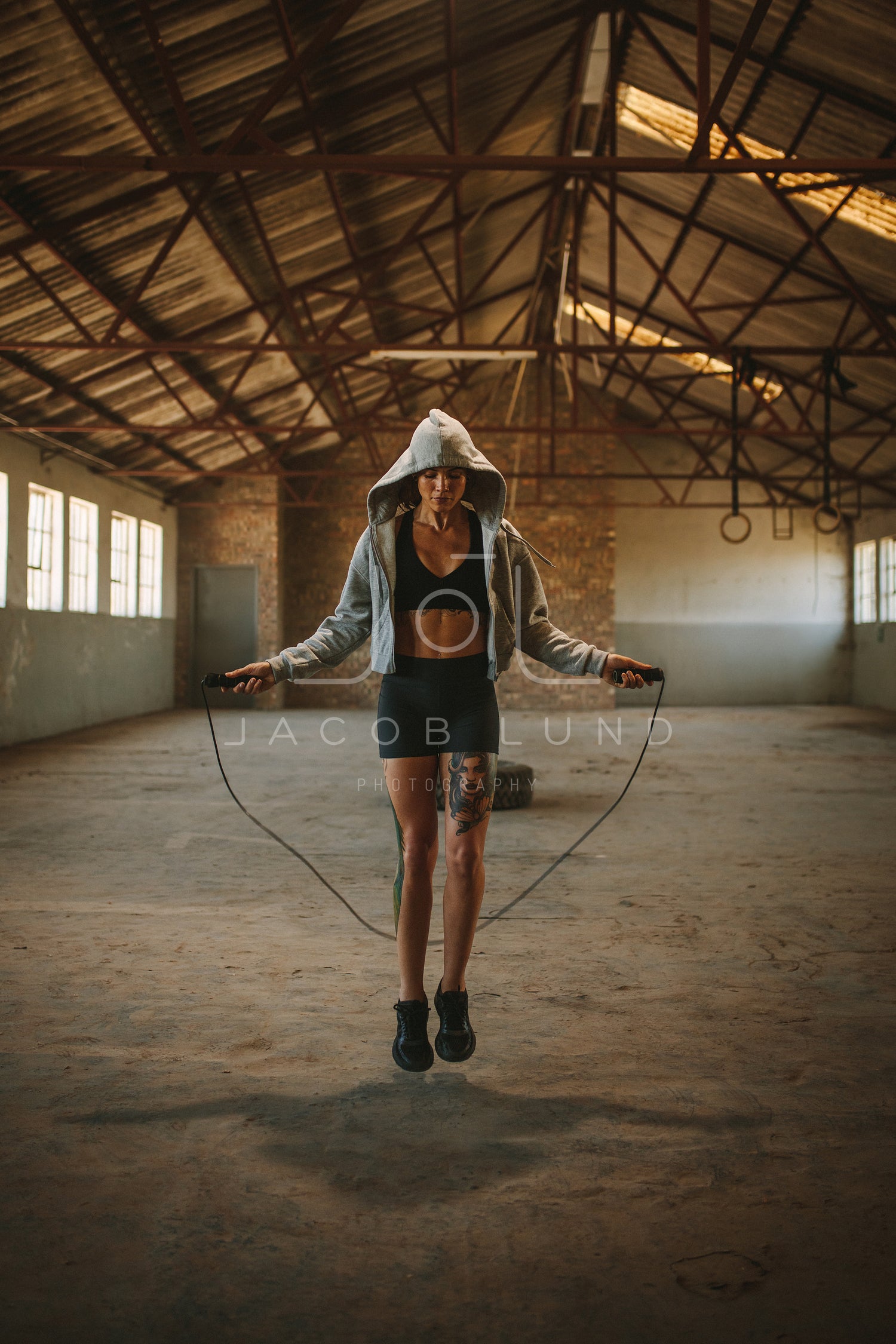 Fit young woman skipping rope – Jacob Lund Photography Store