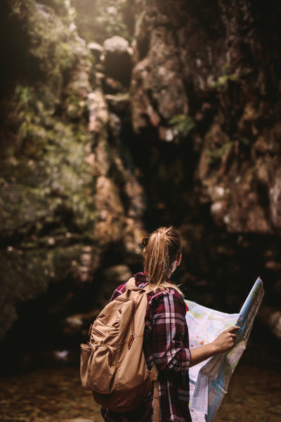 Beautiful woman hiker with a map – Jacob Lund Photography Store- premium  stock photo