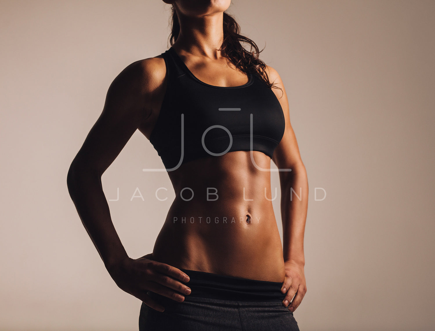 Muscular woman in sports bra – Jacob Lund Photography Store- premium stock  photo