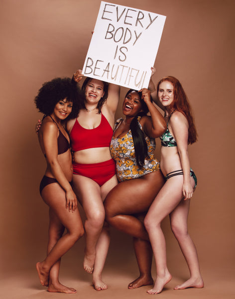 Plus size woman in lingerie holding her belly – Jacob Lund