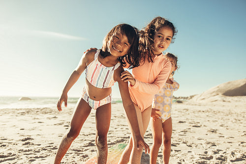 Active little girls having fun together at the beach – Jacob Lund