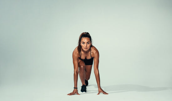 Female athletes show off their toned bodies as they stand back to back –  Jacob Lund Photography Store- premium stock photo