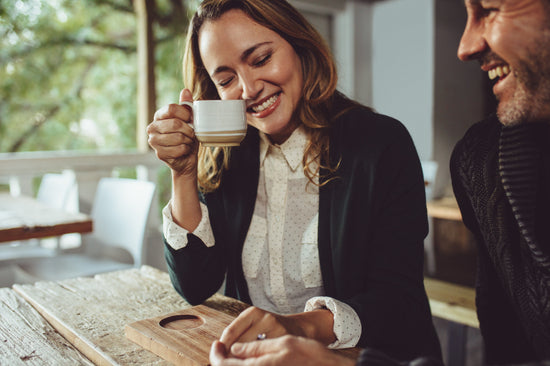 Smiling barista making espresso with a coffee maker – Jacob Lund  Photography Store- premium stock photo