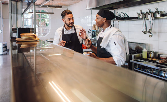 Gourmet chef cooking in a commercial kitchen – Jacob Lund Photography  Store- premium stock photo