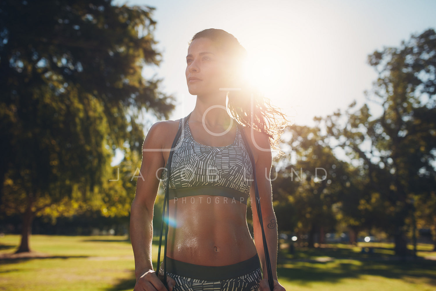 Sportswoman with a skipping rope at the park – Jacob Lund Photography  Store- premium stock photo