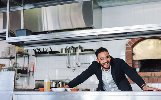 Gourmet chef cooking in a commercial kitchen – Jacob Lund Photography  Store- premium stock photo