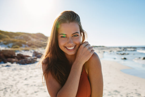 Smiling sexy young woman in her underwear Stock Photo by jacoblund