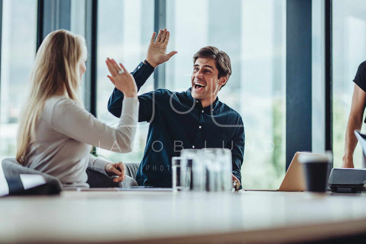 Coworkers celebrating success – Jacob Lund Photography Store- premium ...