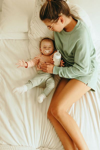 Millennial mom taking a selfie with her adorable baby stock photo