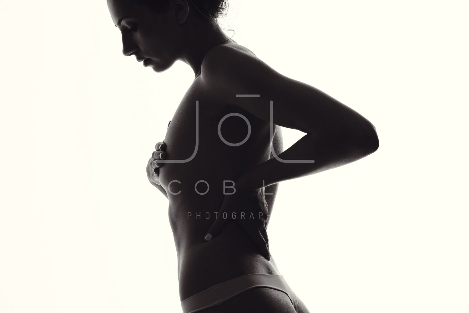 Silhouette of sensual female covering her breast – Jacob Lund Photography  Store- premium stock photo