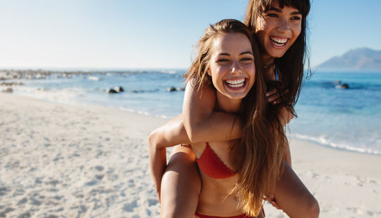 Beautiful women enjoying summer vacation on the beach – Jacob Lund  Photography Store- premium stock photo