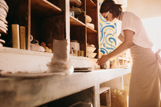 Potter moulding clay on pottery wheel – Jacob Lund Photography Store-  premium stock photo