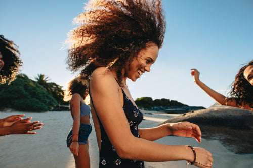 Two happy women sitting on the promenade with beach workout essentials –  Jacob Lund Photography Store- premium stock photo