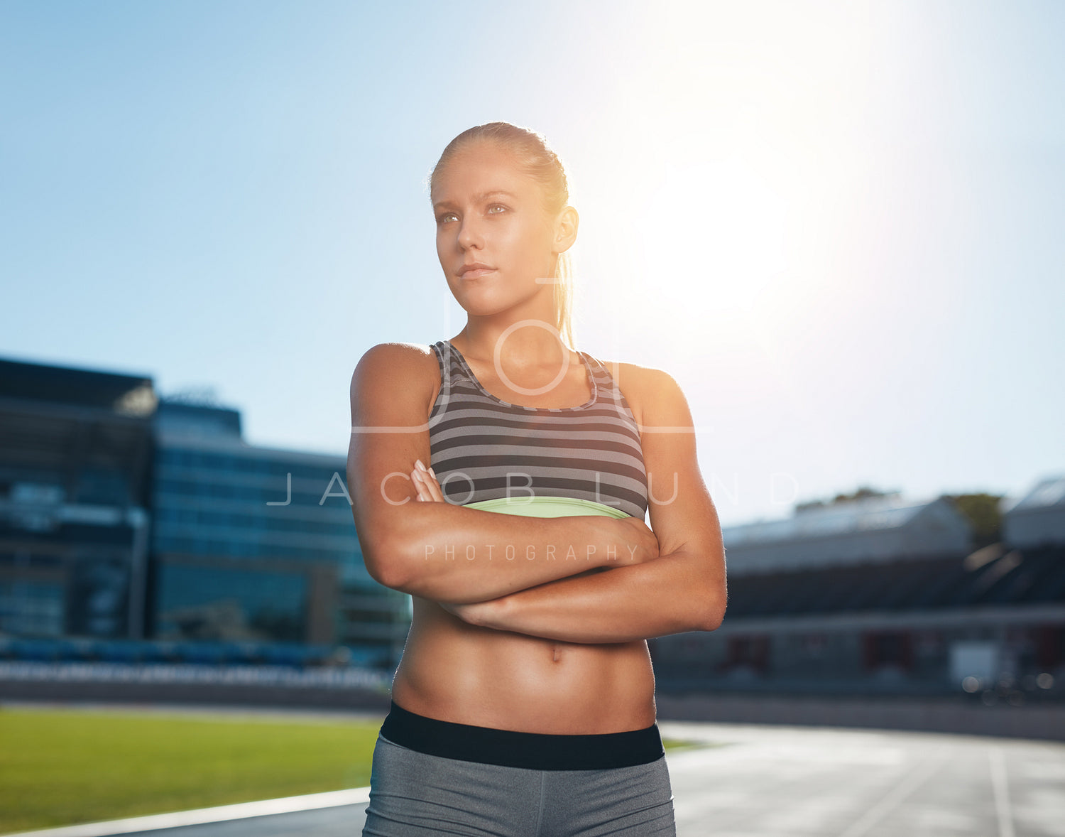 Female runner standing on race track – Jacob Lund Photography Store-  premium stock photo
