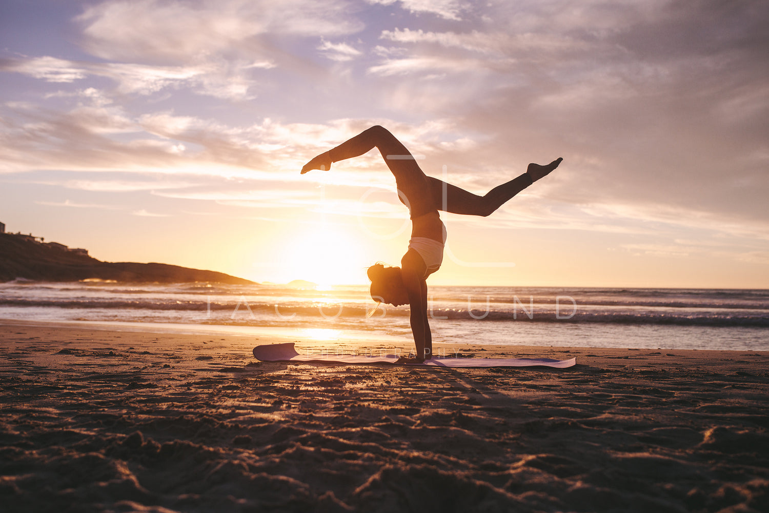 Premium Photo  A woman practicing yoga on the beach at sunset