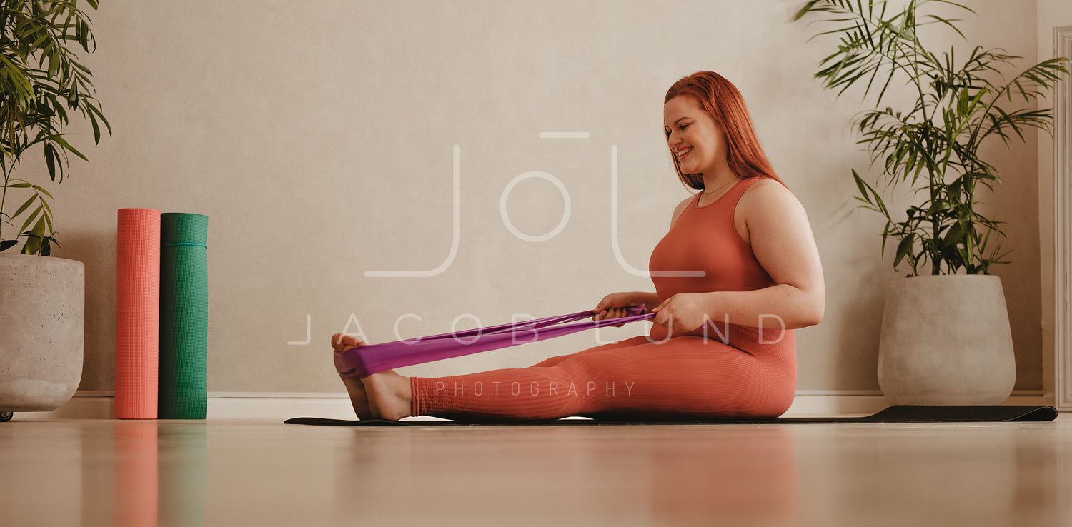 Plus size woman workout with resistance band – Jacob Lund Photography  Store- premium stock photo