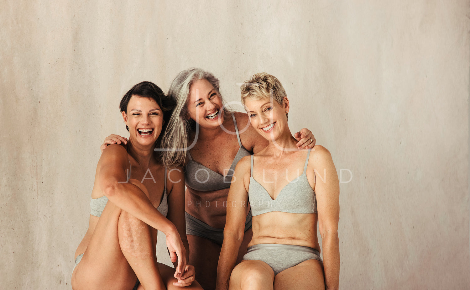 Three happy and confident women embracing their aging bodies