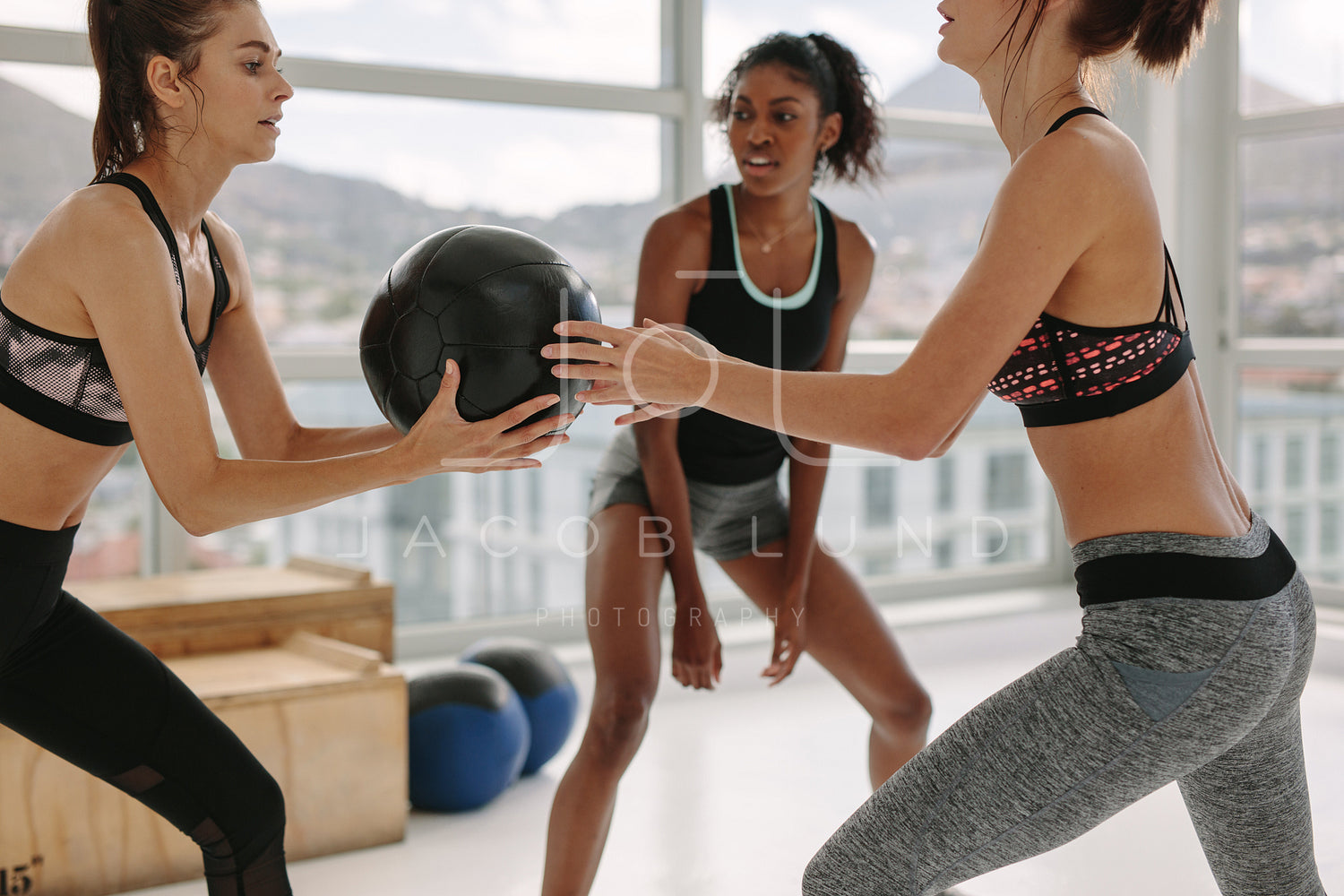 Premium Photo  Female personal trainer helping woman doing exercises in  the gym.