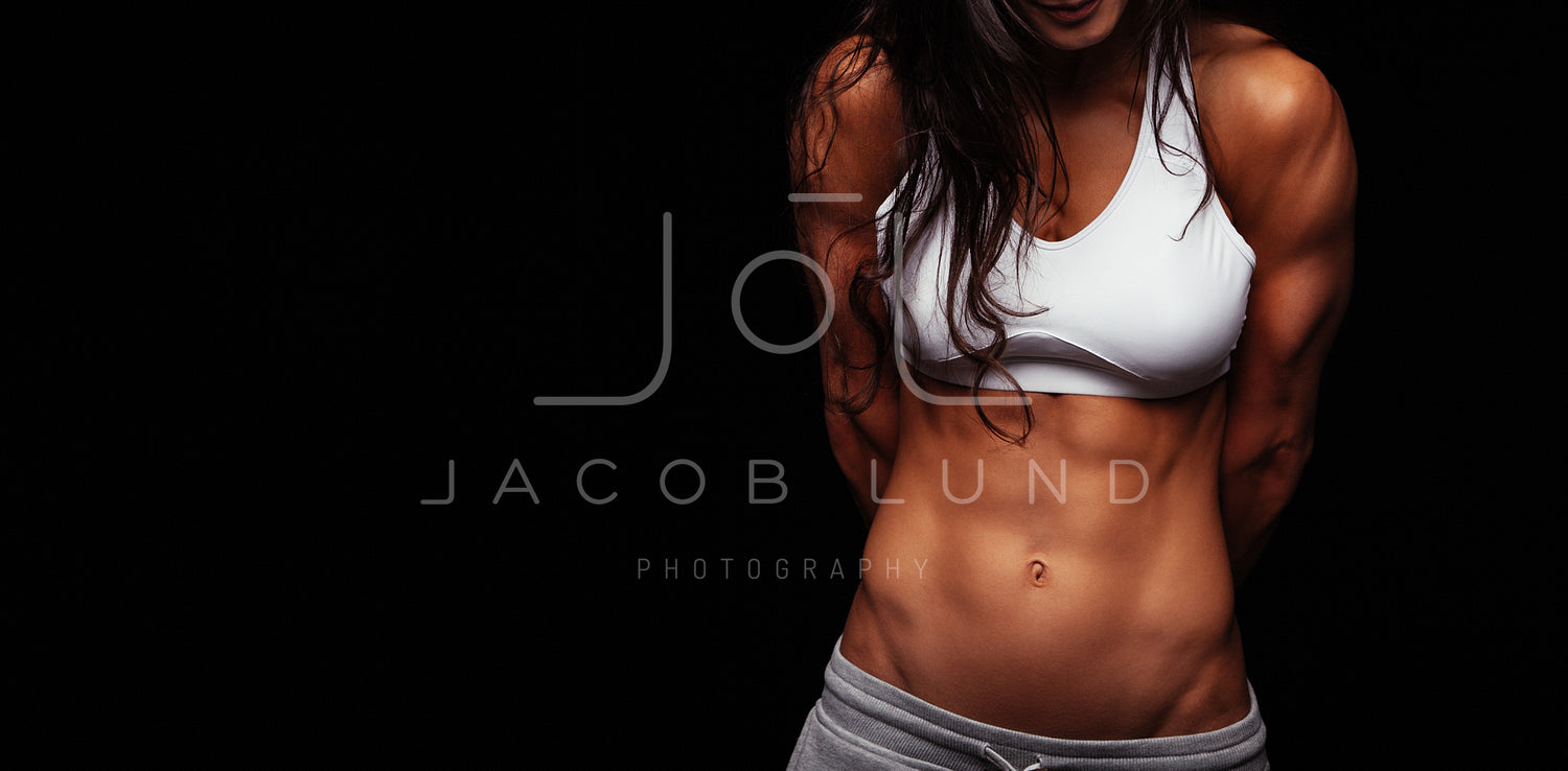 Female athlete with muscular abs – Jacob Lund Photography Store