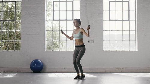 Woman exercising with dumbbells at fitness studio – Jacob Lund