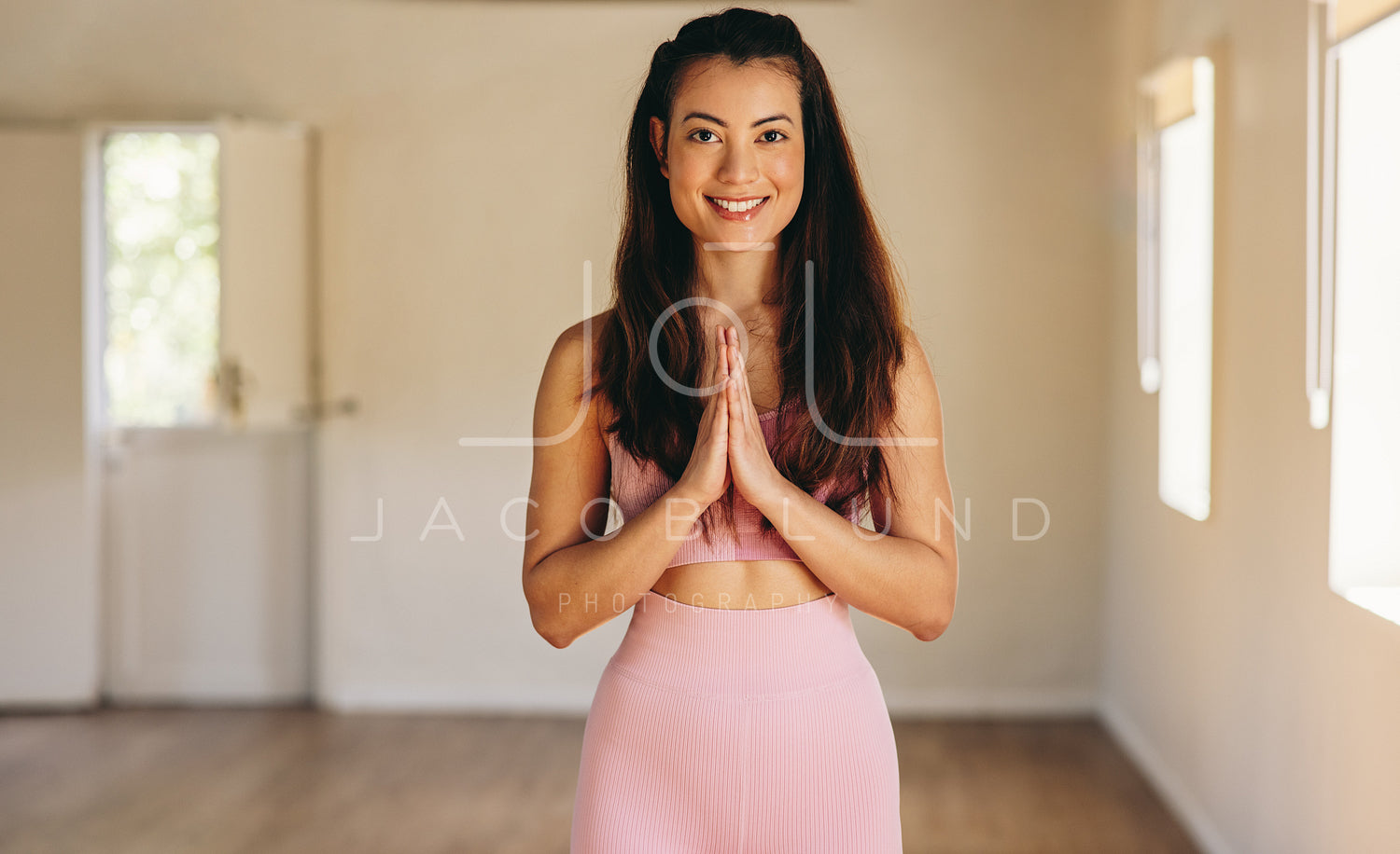 Female yoga instructor standing in a fitness studio