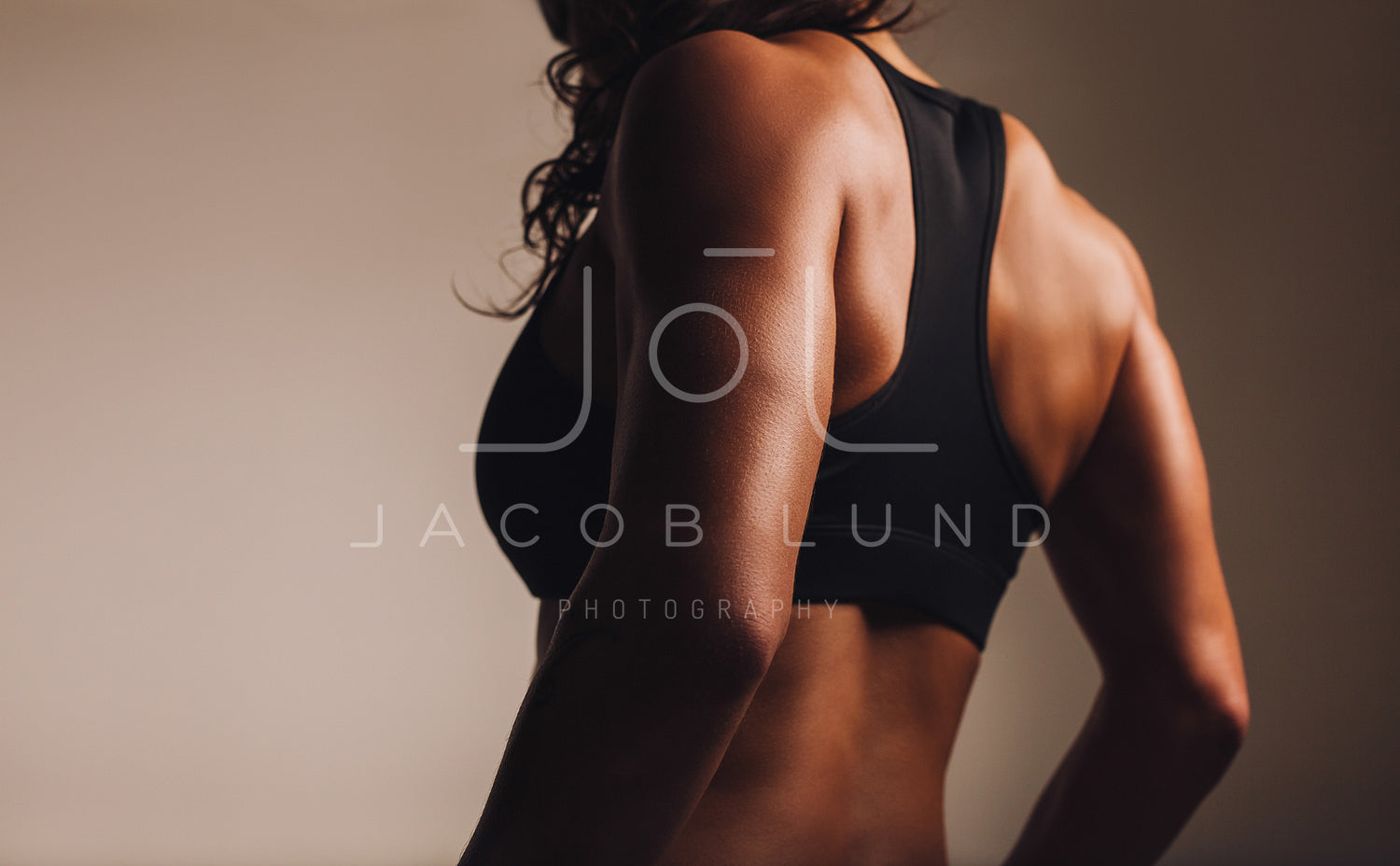 Back of a fit woman athlete in sports bra – Jacob Lund Photography Store-  premium stock photo