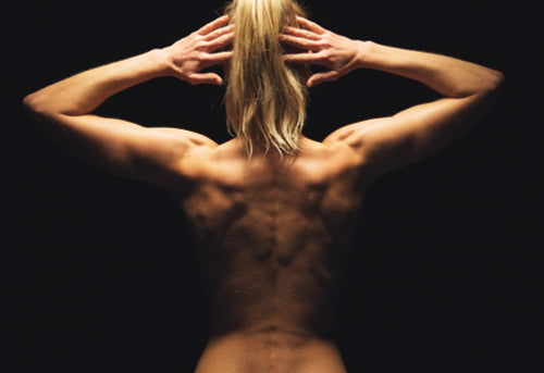Fit Topless Woman Showing Back Muscles Shot From Behind Stock