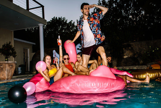 Happy people enjoying swimming pool party - UpLabs