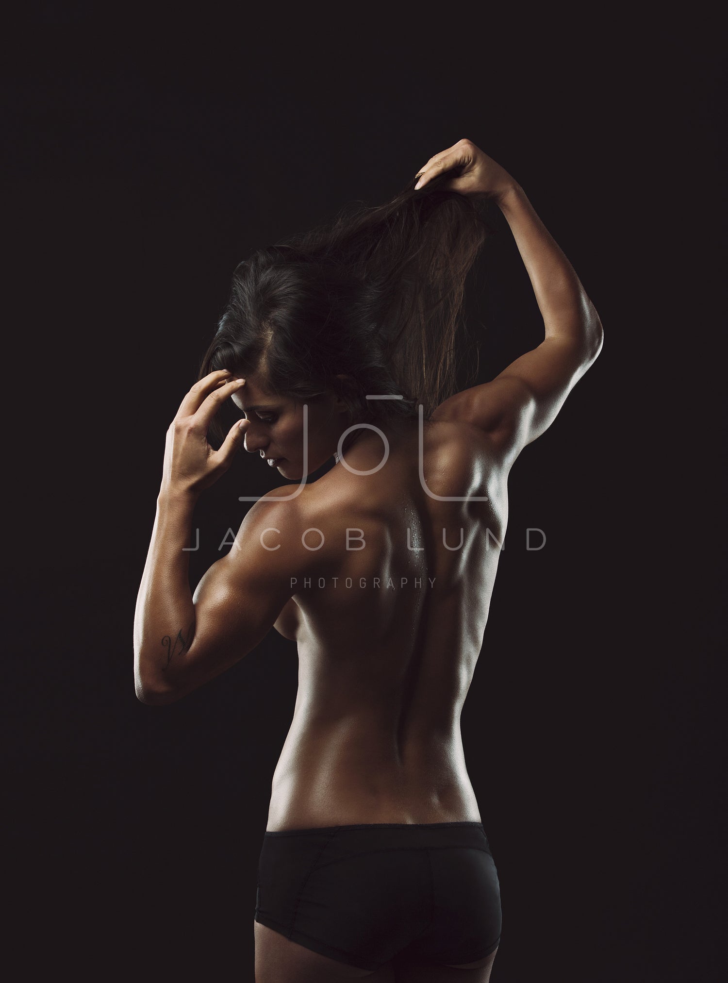 Back of female fitness model – Jacob Lund Photography Store- premium stock  photo