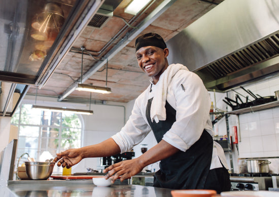 Gourmet chef cooking in a commercial kitchen – Jacob Lund Photography  Store- premium stock photo