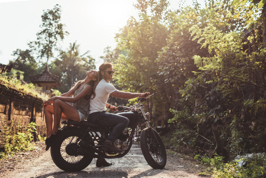 Young Couple Riding Motorcycle On Rural Road – Jacob Lund