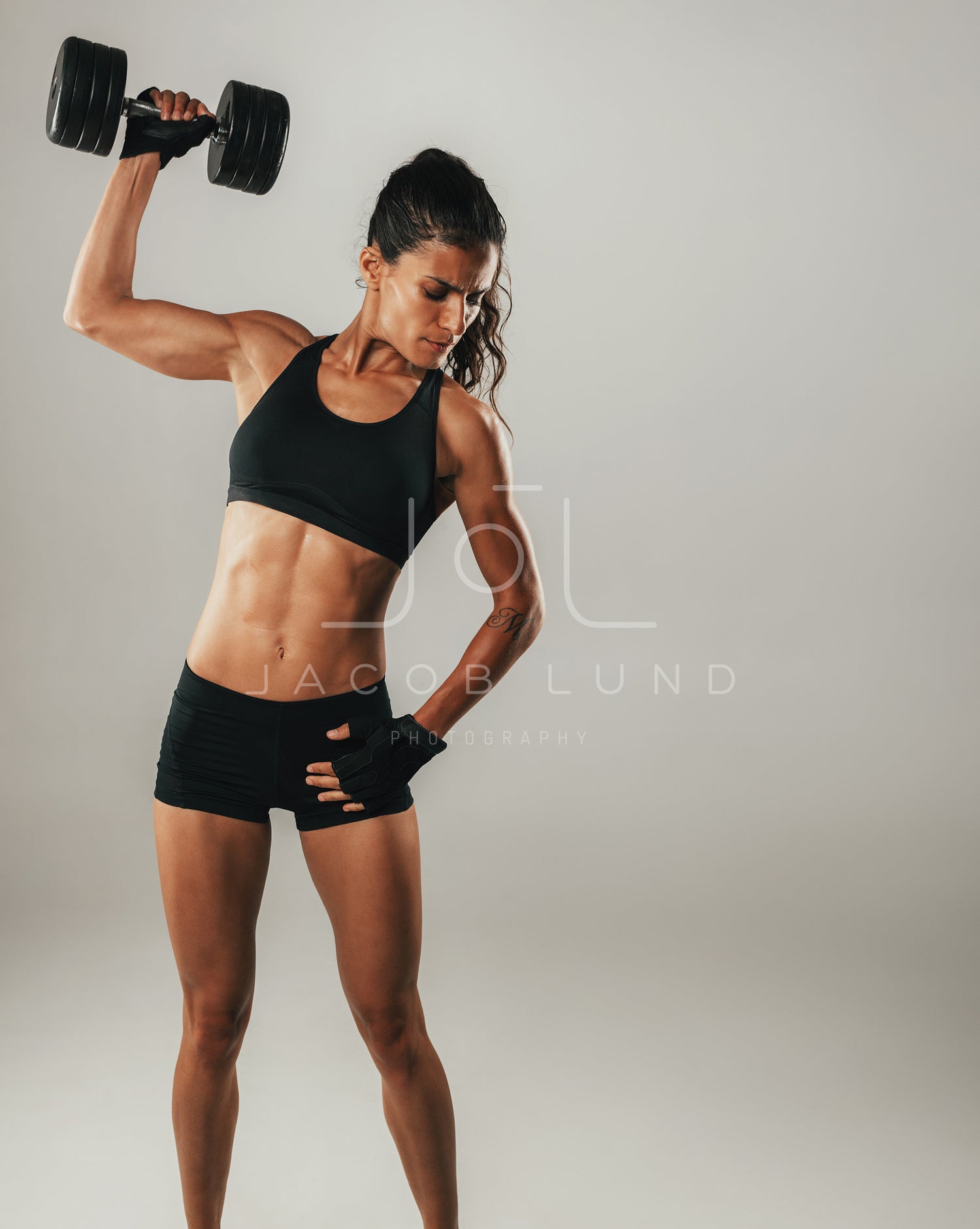 Fit strong young woman with a toned muscular body