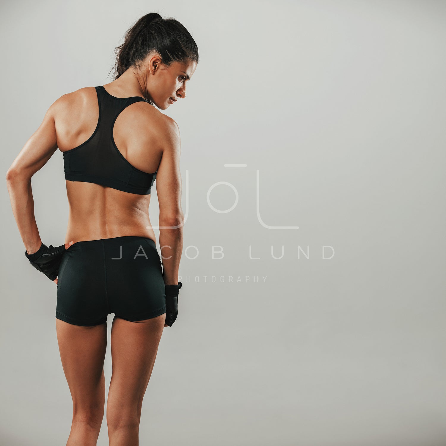 Rear Three Quarter View Of Female Bodybuilder, Lady Bodybuilder Photo