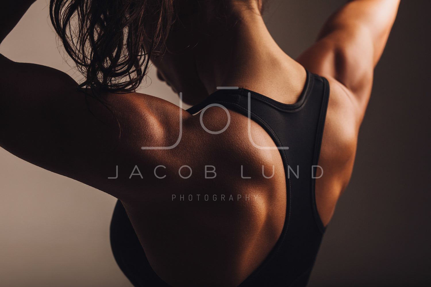 Back of female fitness model – Jacob Lund Photography Store- premium stock  photo