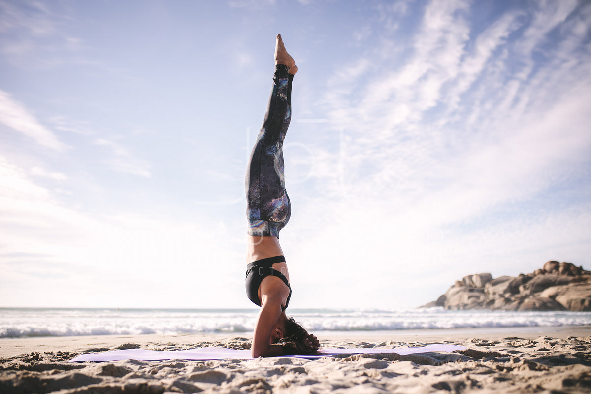 Woman doing Natarajasana yoga pose on the beach – Jacob Lund Photography  Store- premium stock photo