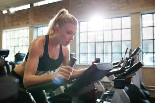 Young woman resting after workout in gym – Jacob Lund Photography Store-  premium stock photo