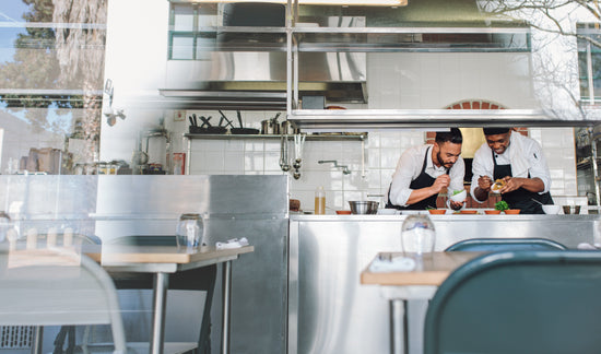 Gourmet chef cooking in a commercial kitchen – Jacob Lund Photography  Store- premium stock photo