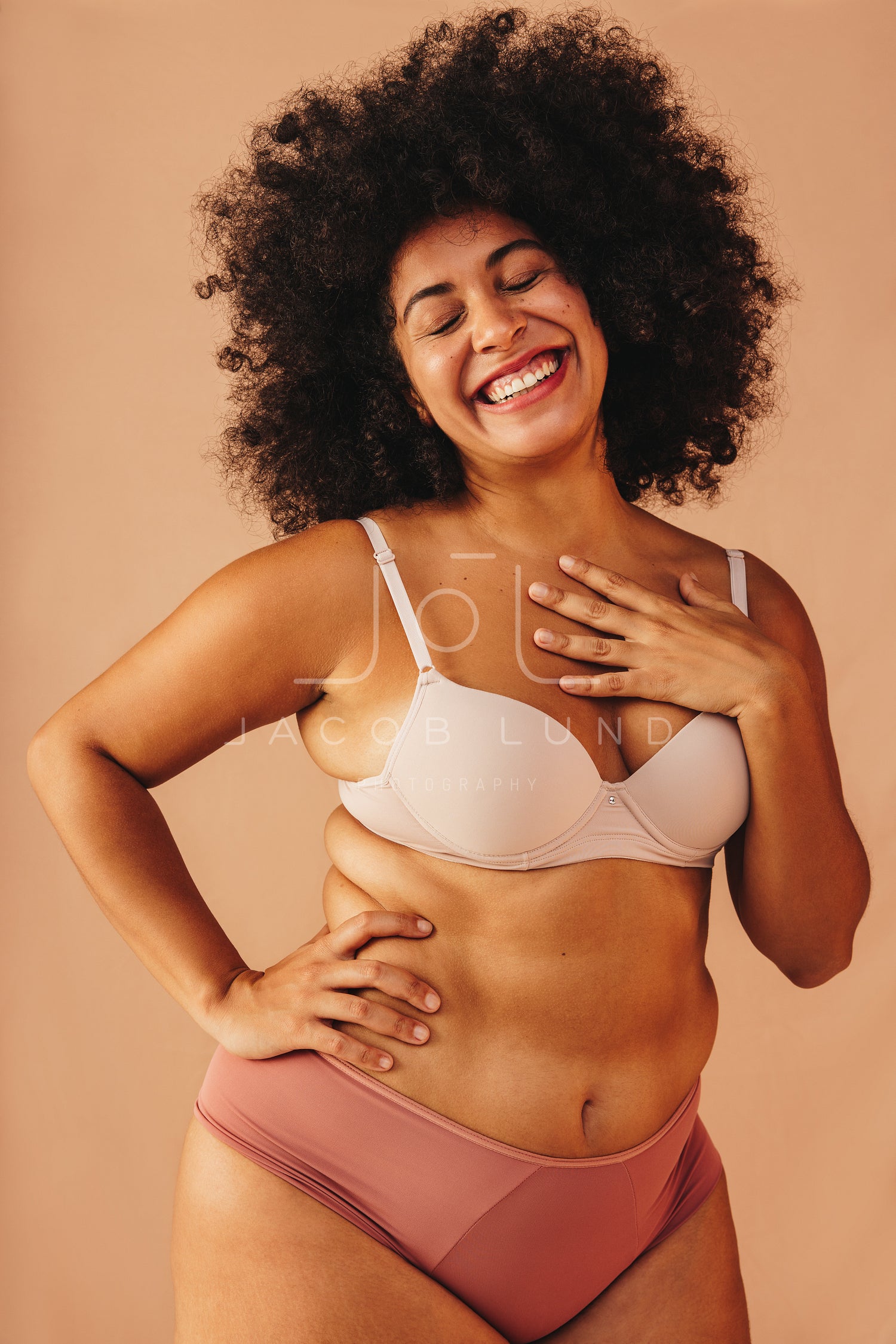 Beautiful plus size woman smiling happily in underwear – Jacob
