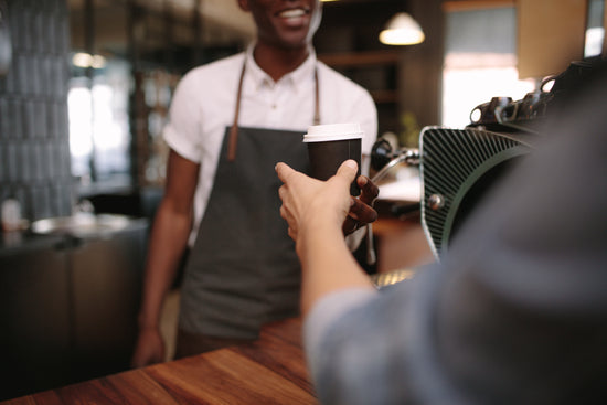 Smiling barista making espresso with a coffee maker – Jacob Lund  Photography Store- premium stock photo